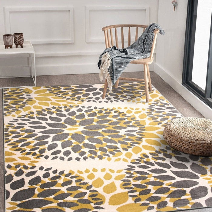 3'1" x 5' Grey Yellow Floral Woven Stain Resistant Polypropylene Area Rug in room with chair and decor