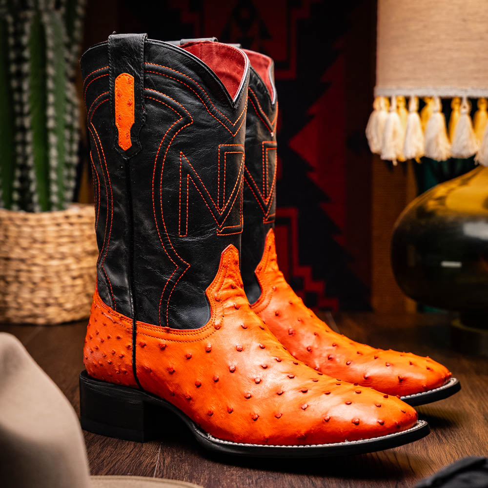 Alabama Orange cowboy boots made of genuine ostrich skin with elegant design and durable craftsmanship.