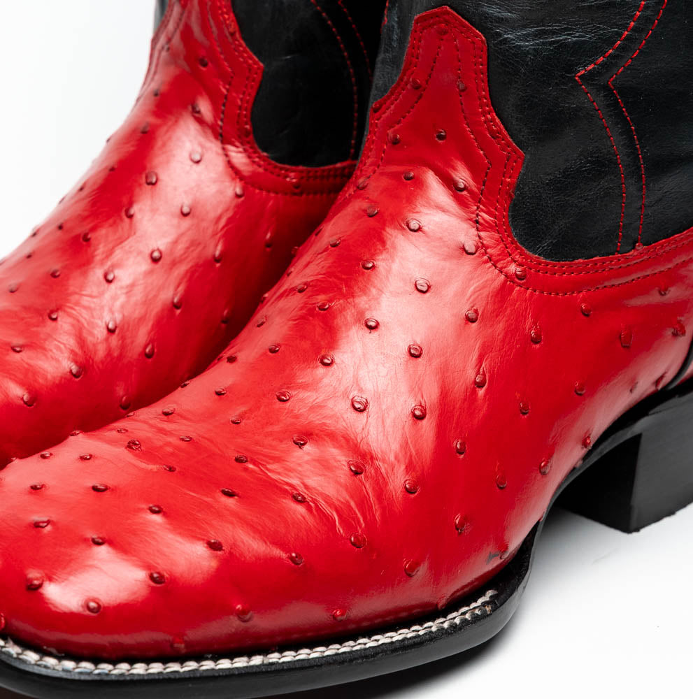 Close-up of Alabama Red genuine ostrich skin cowboy boots, showcasing craftsmanship and style.