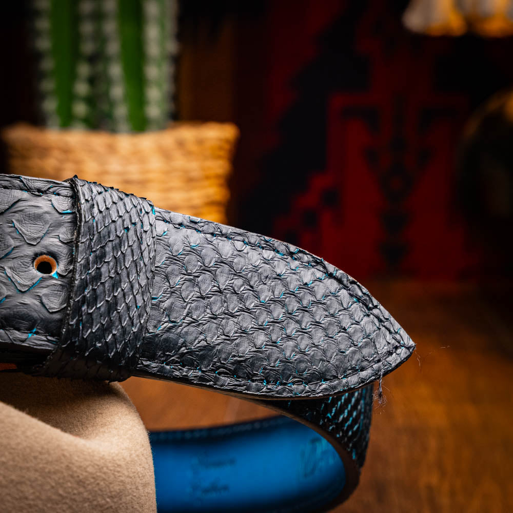 Arkansas Belt Black / Blue crafted from genuine python skin with antique brass buckle showcasing its exotic elegance and texture.