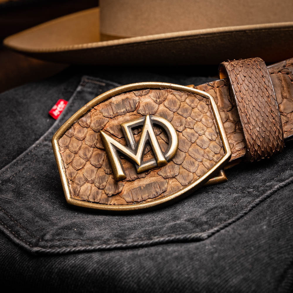 Arkansas Belt Brown with genuine python skin and antique brass buckle on black denim background.