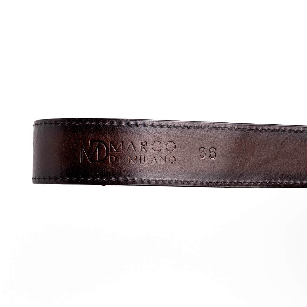 Close-up of premium leather belt with embossed branding, showcasing craftsmanship and style.
