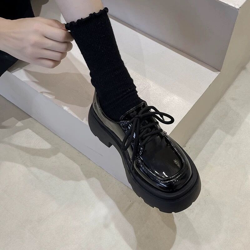 Women’s British Style Chunky Sole Leather Shoes – Trendy Loafers with Elevated Heel displayed on a stair.