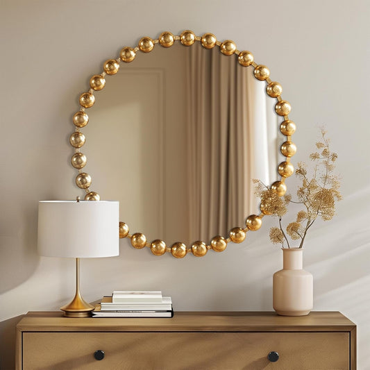 Round Wall Mirror With Gold Metal Frame 27 Inch Entryway over a console table with decorative items