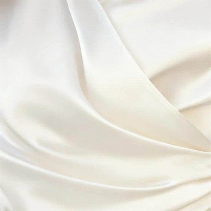 Close-up fabric detail of Women's Elegant Cross V-Neck Blouse, Ruffle Detail Button Accent Office Shirt in cream color