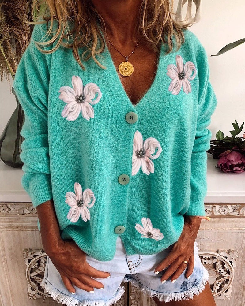 Cozy floral Women’s V Neck Crochet Cardigan in teal, perfect for layering in fall and winter; chic, loose knit with button details.