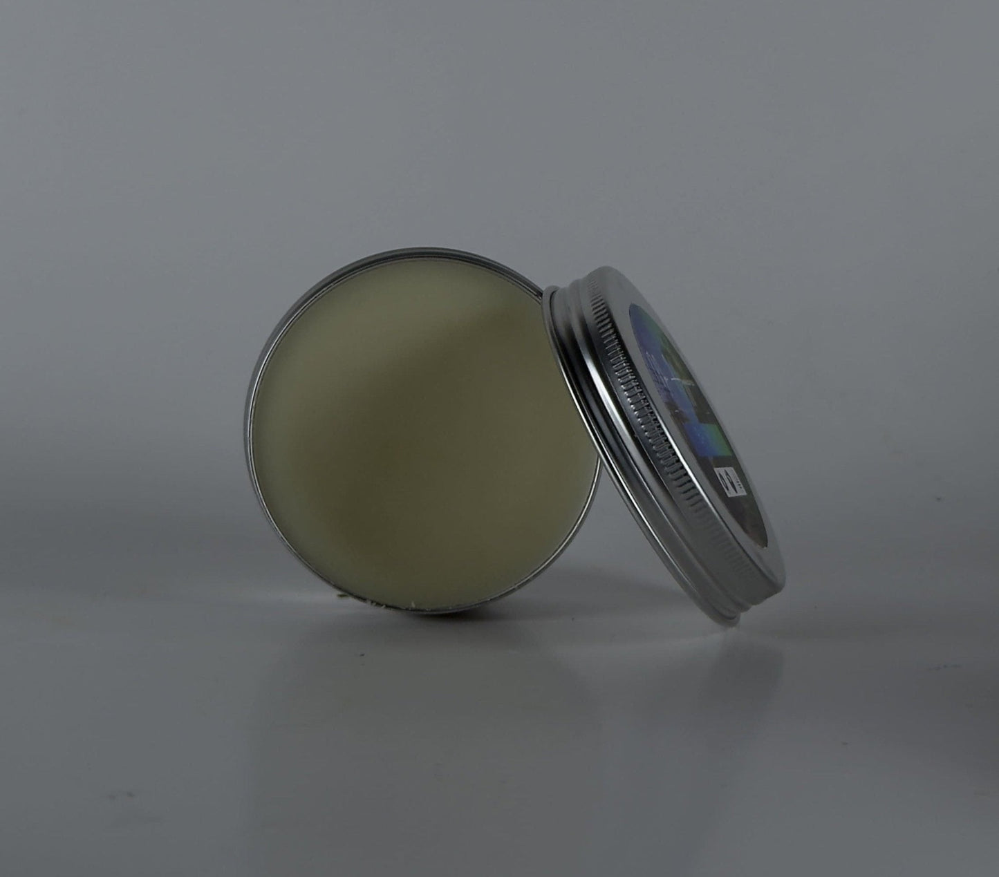 Open tin of Bay Rum Beard Balm – Bold Scent & Daily Control, showcasing grooming product for styling and conditioning beards.