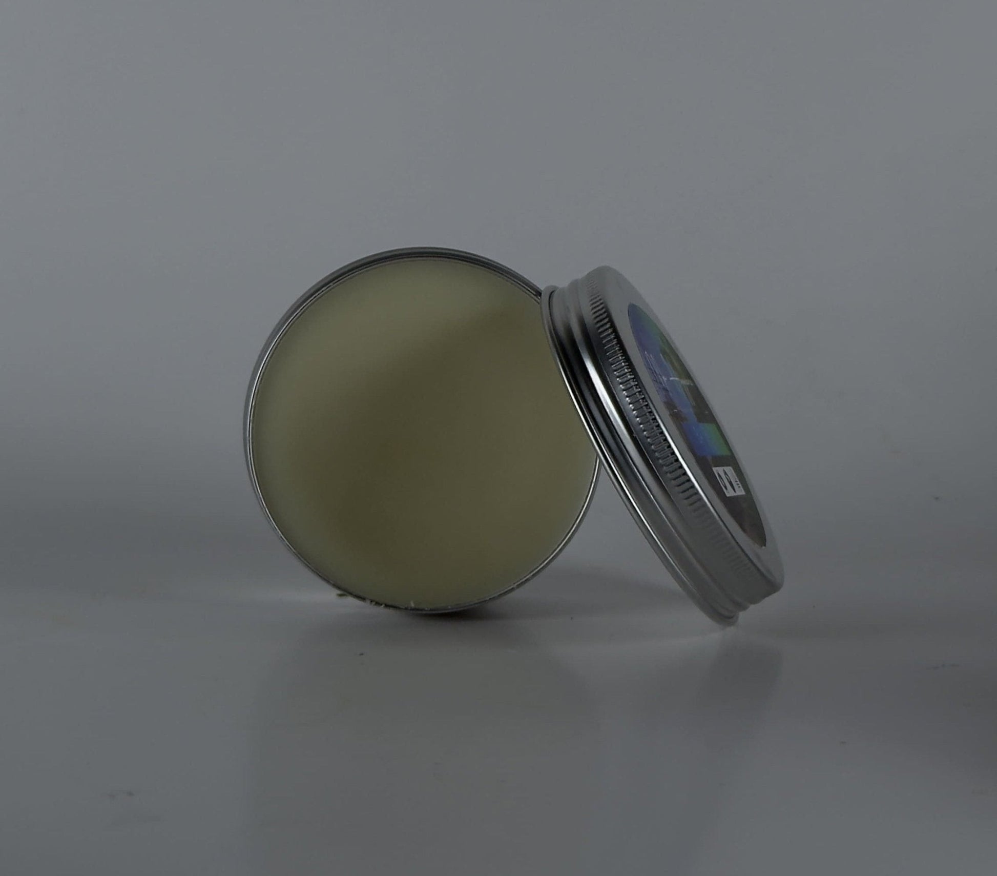 Open tin of Bay Rum Beard Balm – Bold Scent & Daily Control, showcasing grooming product for styling and conditioning beards.