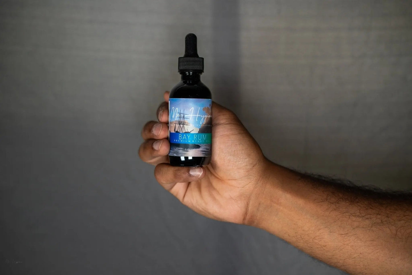 Bay Rum Beard Oil – Classic Scent, Bold Control bottle held in hand, showcasing premium grooming product for nourishing and hydrating beards.