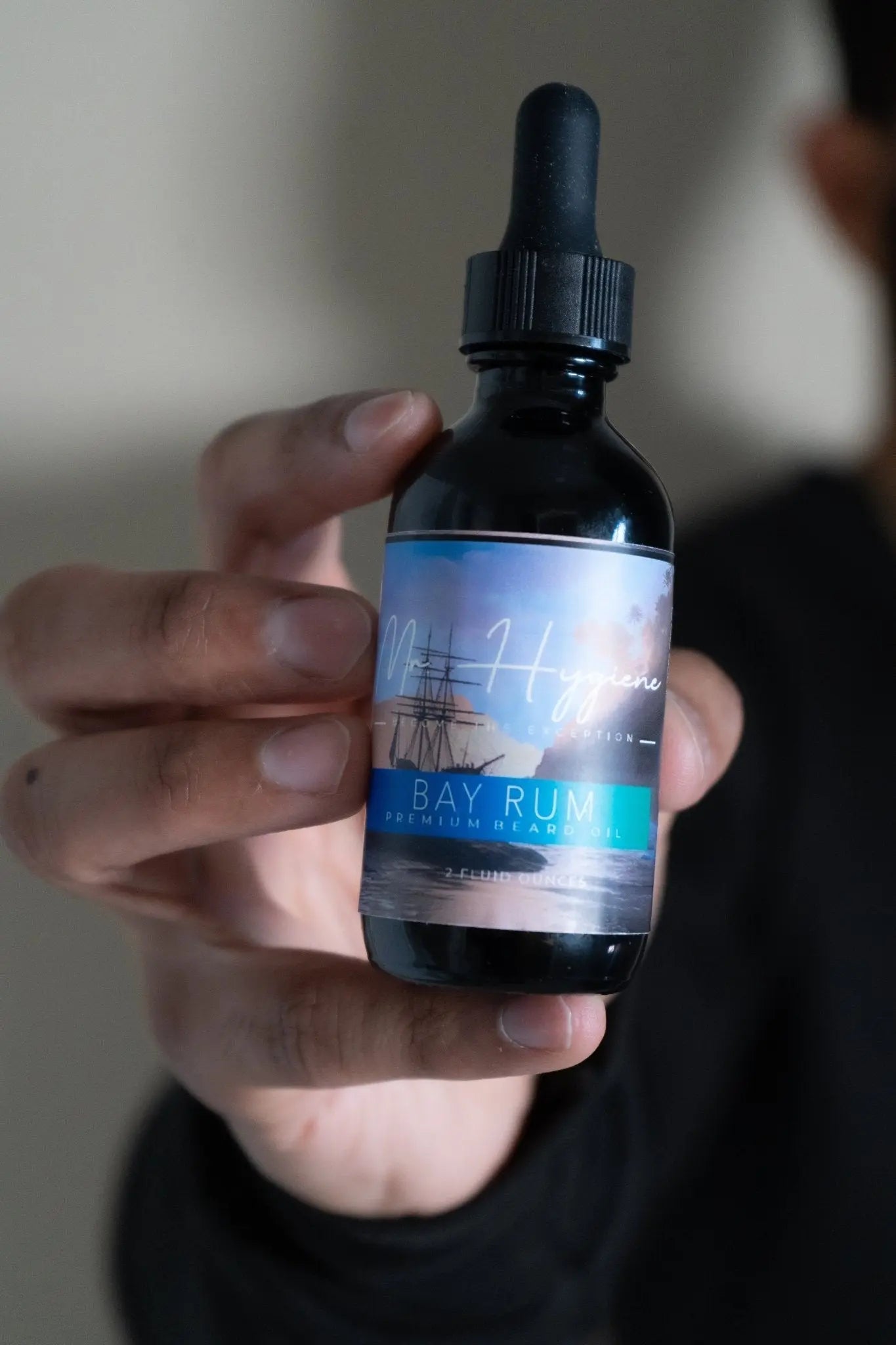 Bay Rum Beard Oil – Classic Scent, Bold Control bottle held in hand, featuring the signature invigorating scent for refined grooming.