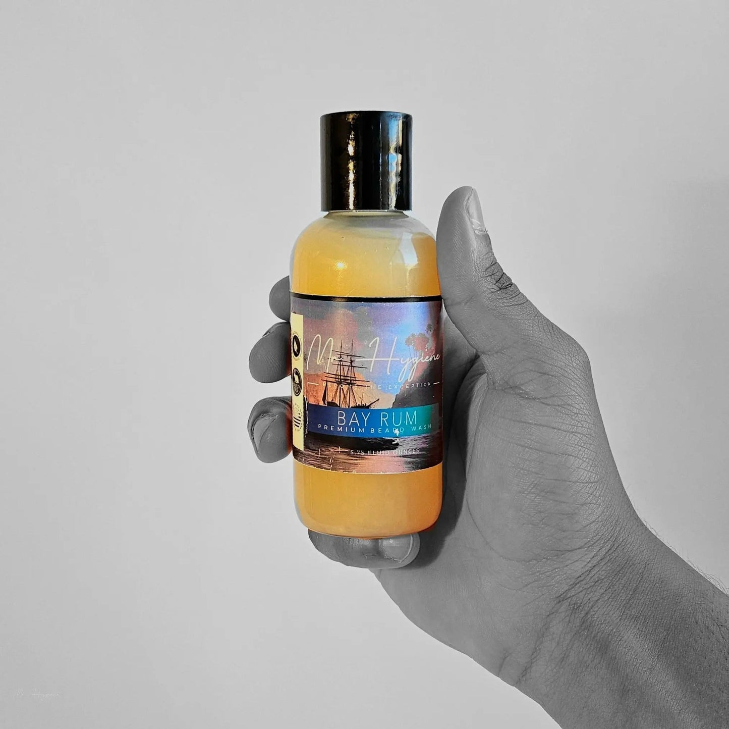 Hand holding Bay Rum Beard Wash – Bold Scent, Clean Beard Routine bottle.