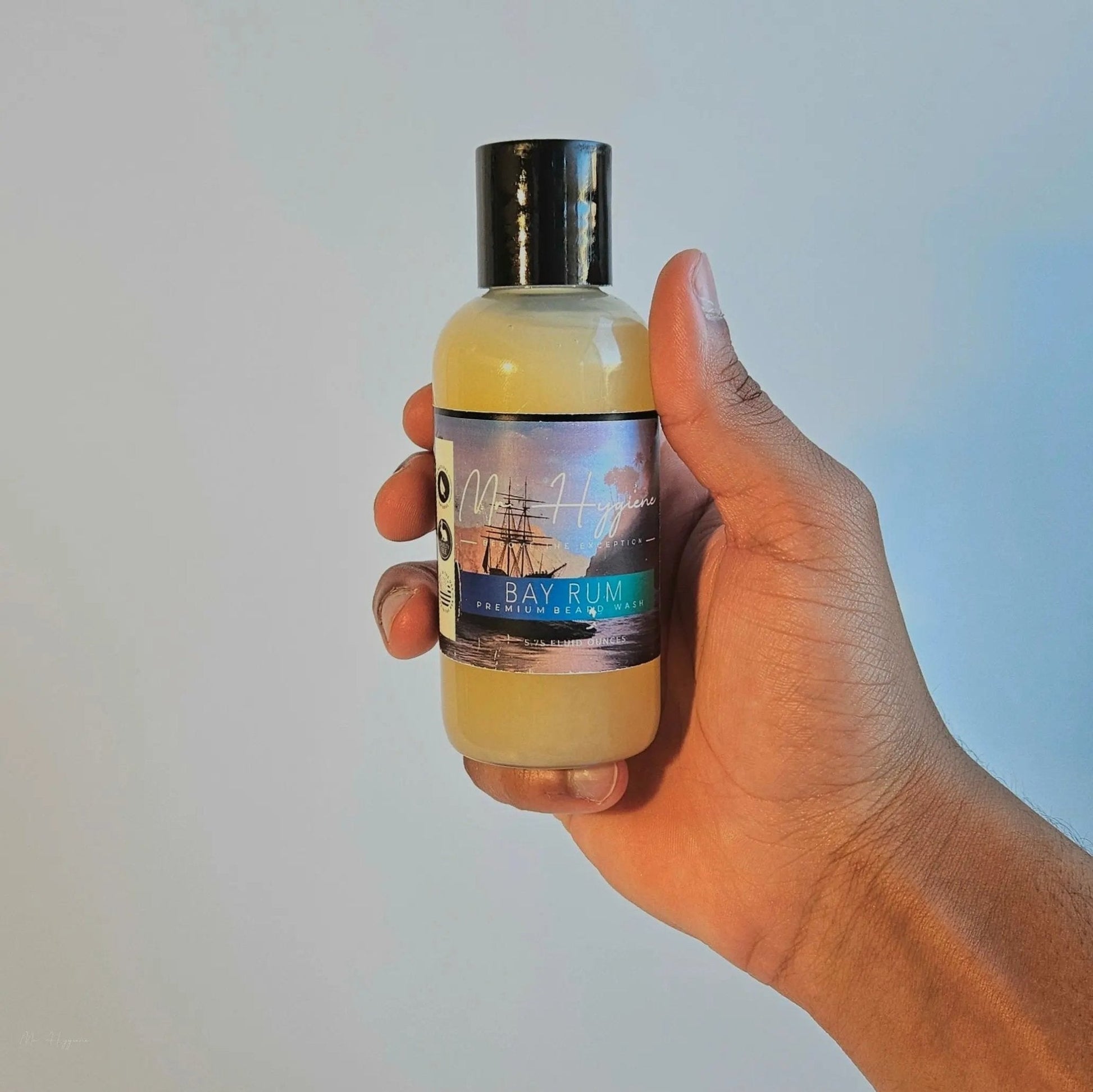 Person holding Bay Rum Beard Wash – Bold Scent, Clean Beard Routine bottle