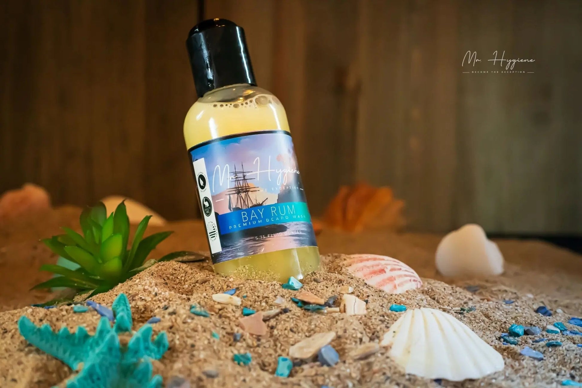 Bay Rum Beard Wash – Bold Scent, Clean Beard Routine bottle on sandy beach with seashells and green plant
