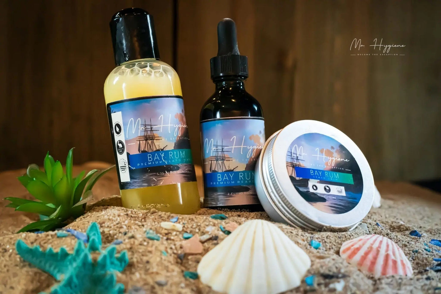 Bay Rum Mens Beard Kit – Bold Scent, Full Grooming Set displayed on sand with seashells and plants