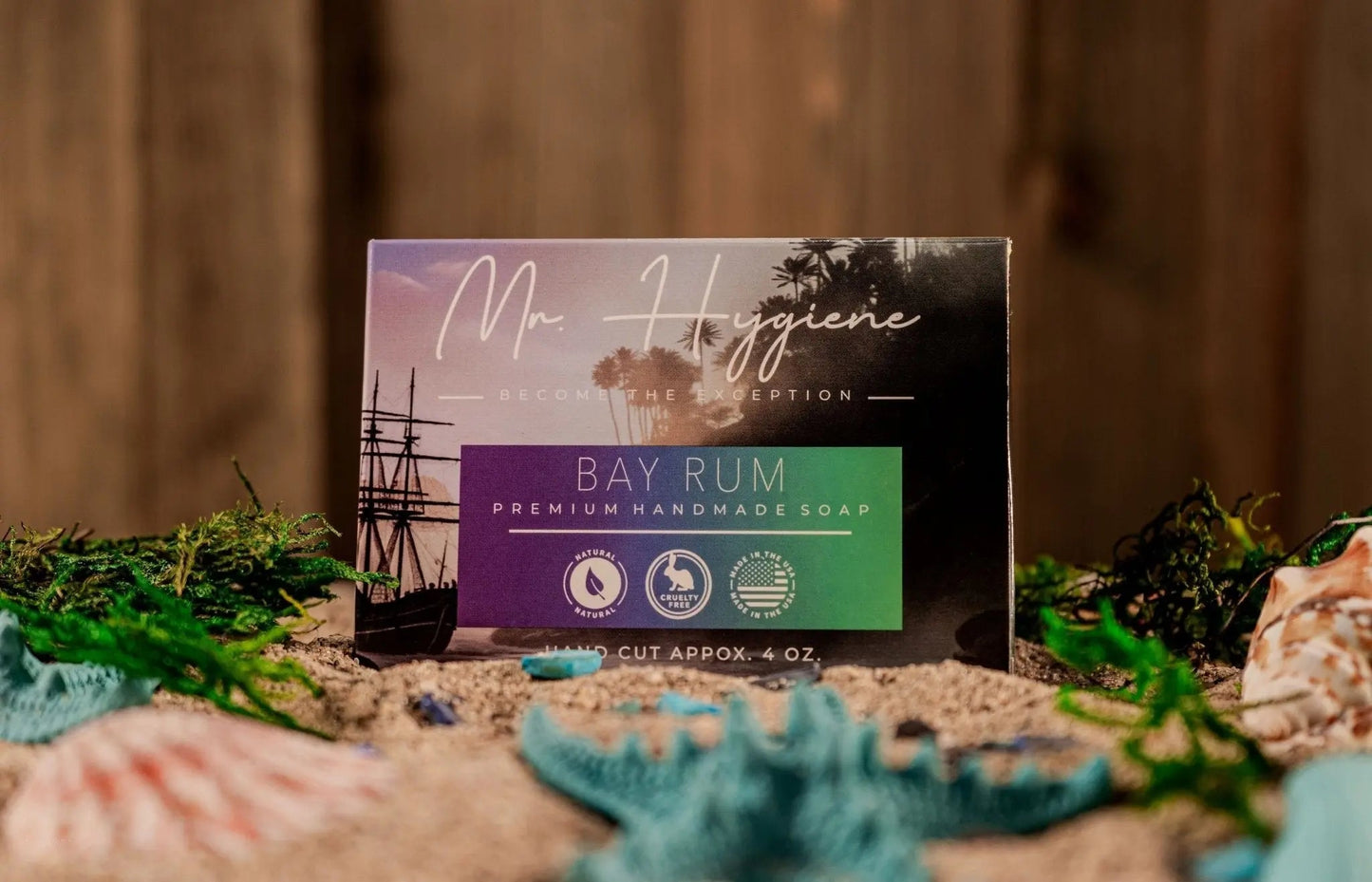 Bay Rum Mens Soap – Classic Scent, Modern Clean packaging on sandy background with seashells and greenery
