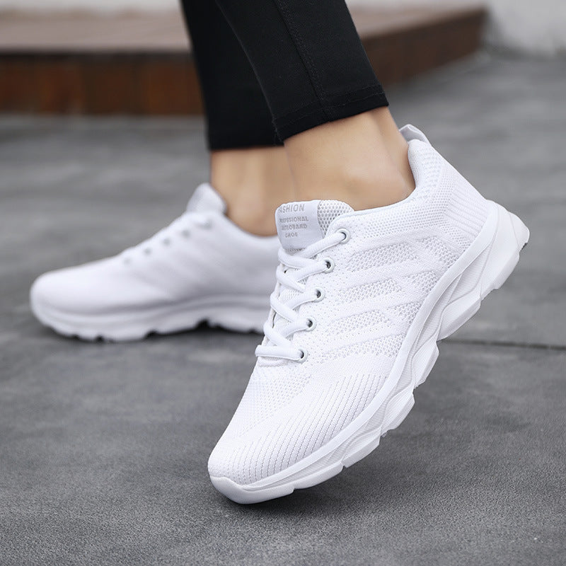 Women’s Mesh Running & Travel Sneakers in white, featuring breathable mesh uppers and cushioned soles, perfect for workouts and travel.