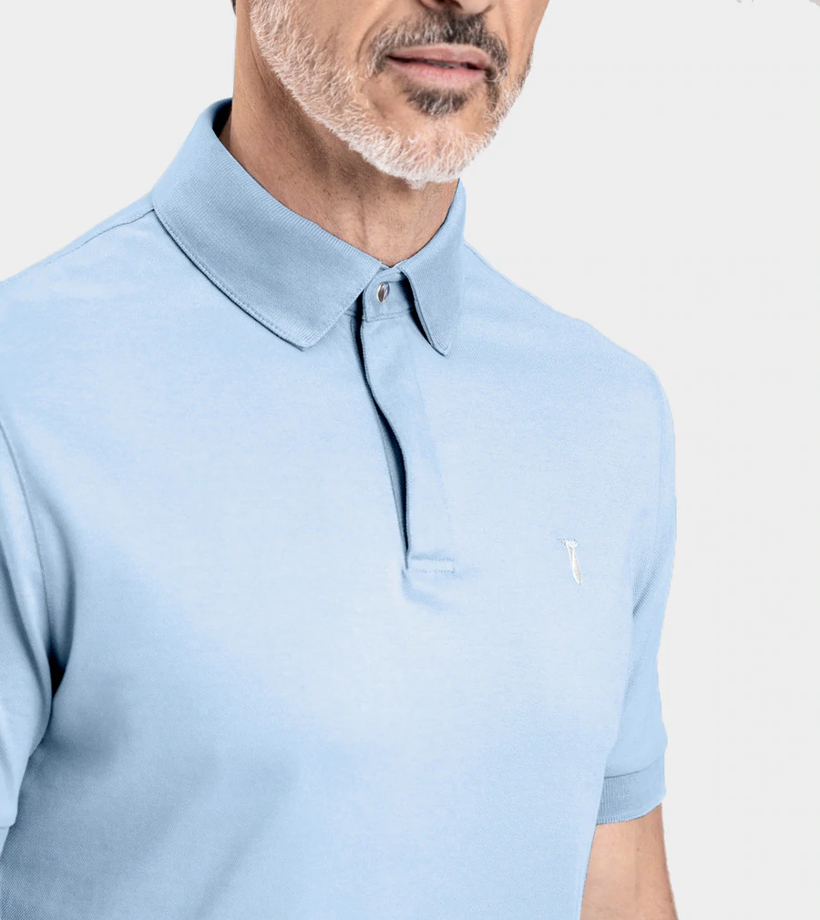 Man wearing a light blue Short Sleeve Perfect Polo with StaySharp Collar and tailored fit.