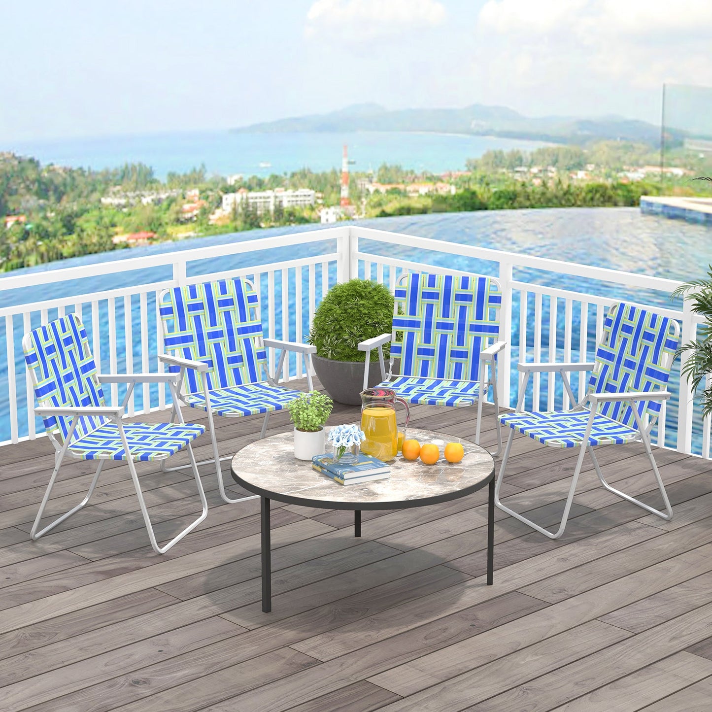 4 Pieces Folding Beach Chair Camping Lawn Webbing Chair-Blue on a patio with a table overlooking a scenic view