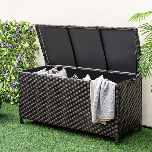 85 Gallon Outdoor Storage Box with Removable Liner and Universal Wheels-Brown in garden setting