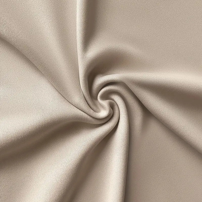 Close-up of beige fabric texture for Women's V-Neck Short Dress With Pockets showing soft material in elegant swirl pattern