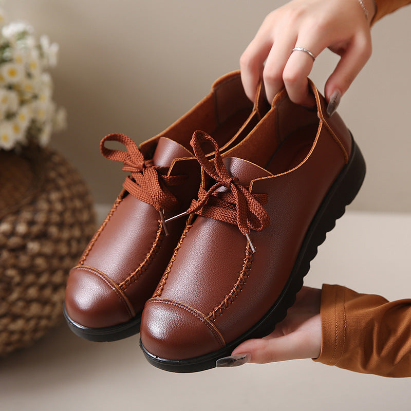 Pair of brown leather casual shoes with stylish laces