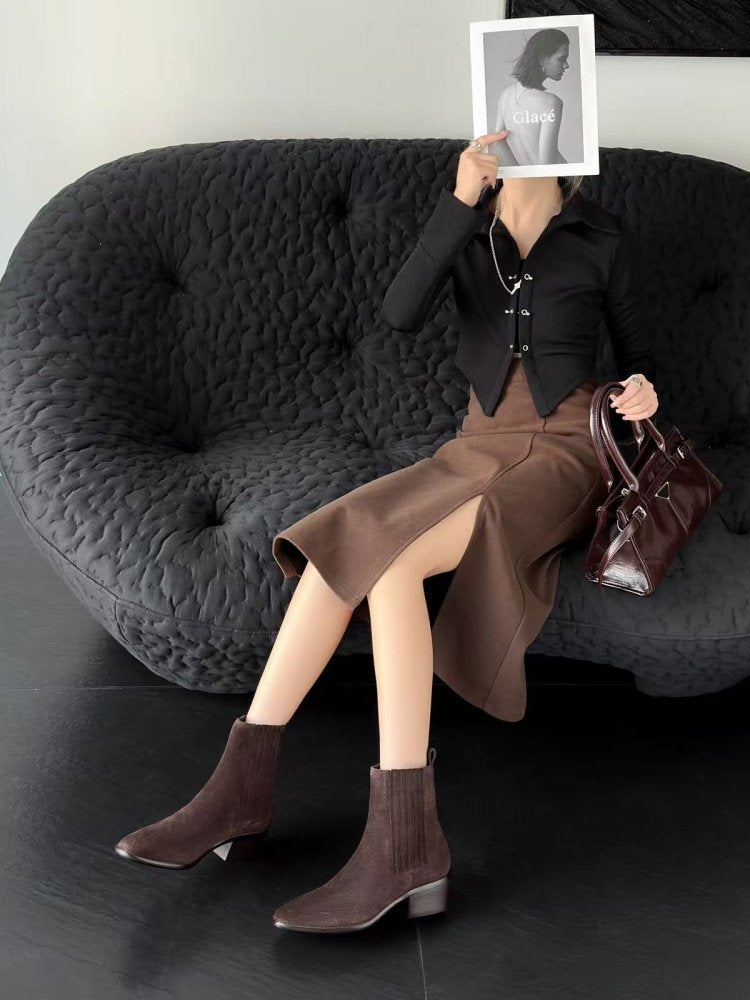 Woman wearing Women's Retro Square-Toe Mid-Heel Chunky Leather Boots sitting on black sofa