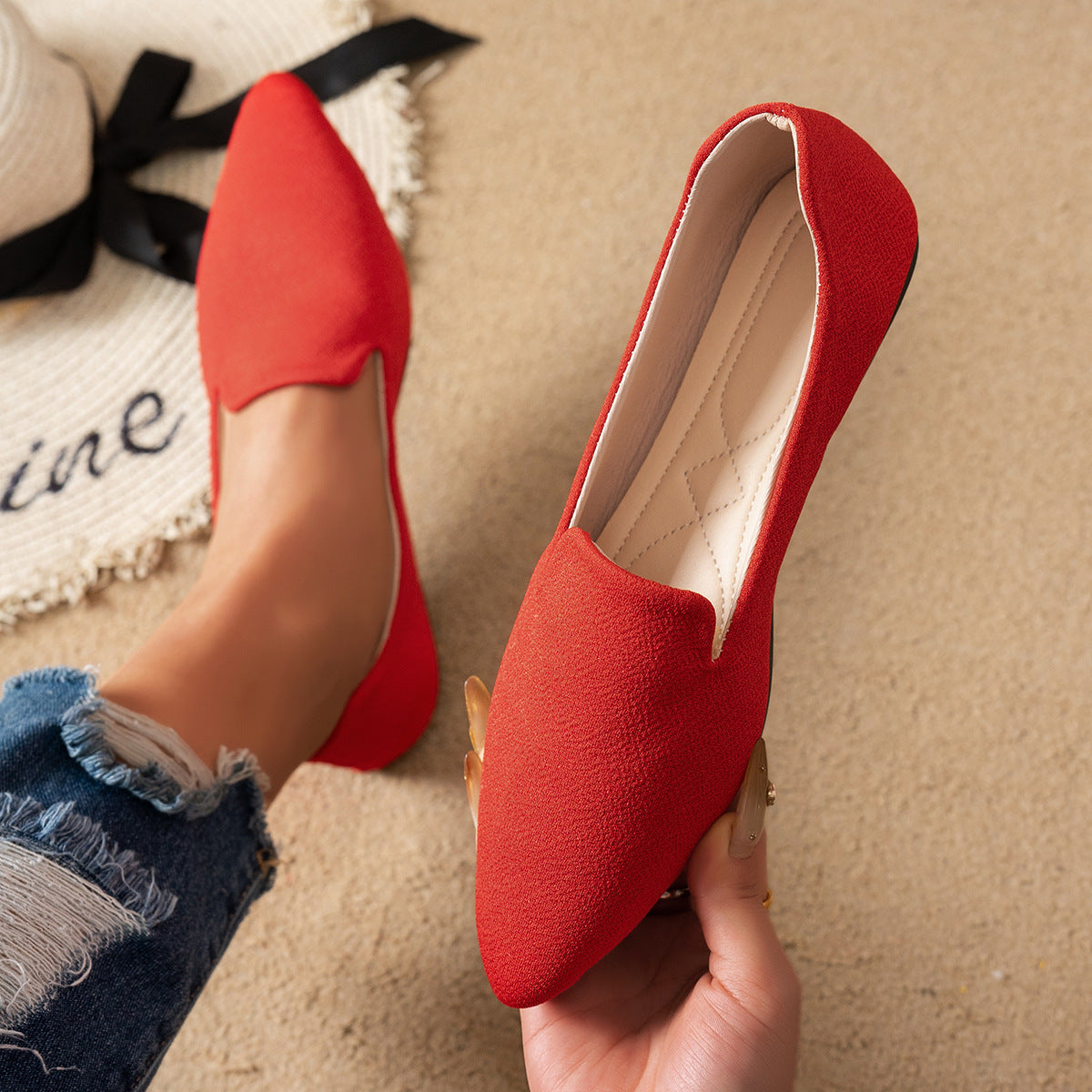 Red Women’s Flat Pointed-Toe Thin Shoes — Casual Everyday Flats on beige background