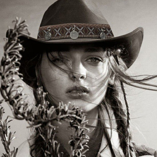 Woman wearing Western Charm Woolen Cowgirl Hat with woven print and pendant charms in a vintage style setting.