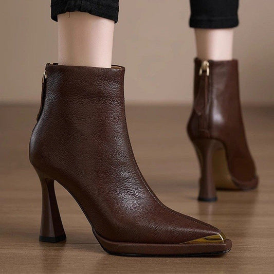 Women’s Pointed-Toe Chunky-Heel Side-Zip Boots in brown leather displayed on a wooden floor.