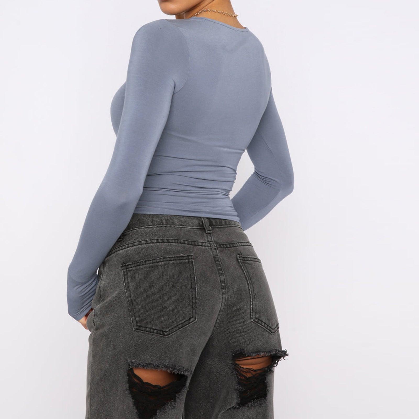 Back view of Slim Fit Long Sleeve Shirt | Women's Casual Crop Tops in blue, paired with black distressed jeans.