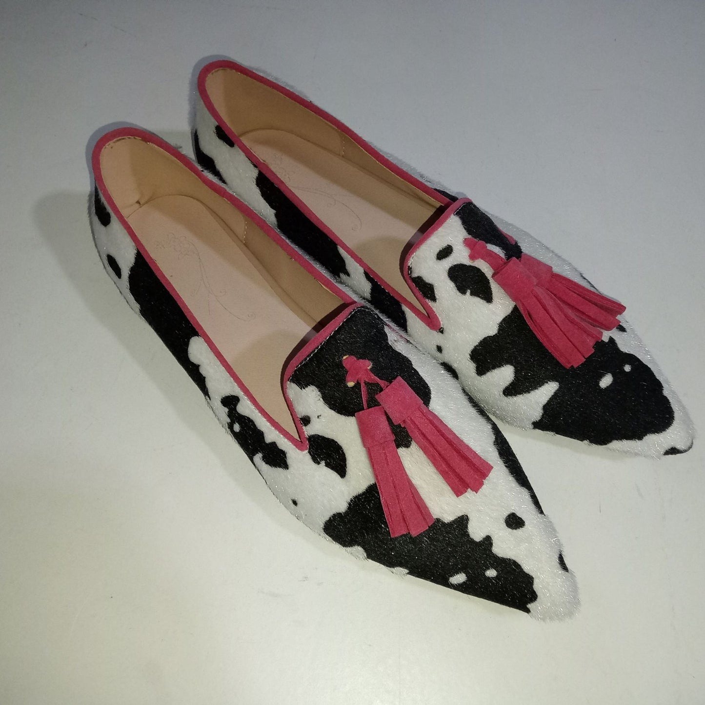 Cow Print Tassel Pumps Women | Casual Slip-On Style with decorative tassels and low heel for versatile day-to-night wear.