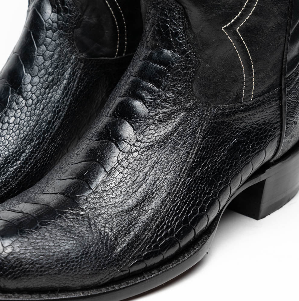 Close-up of Denver Black genuine ostrich leg skin cowboy boots, showcasing exotic leather texture and elegant design.