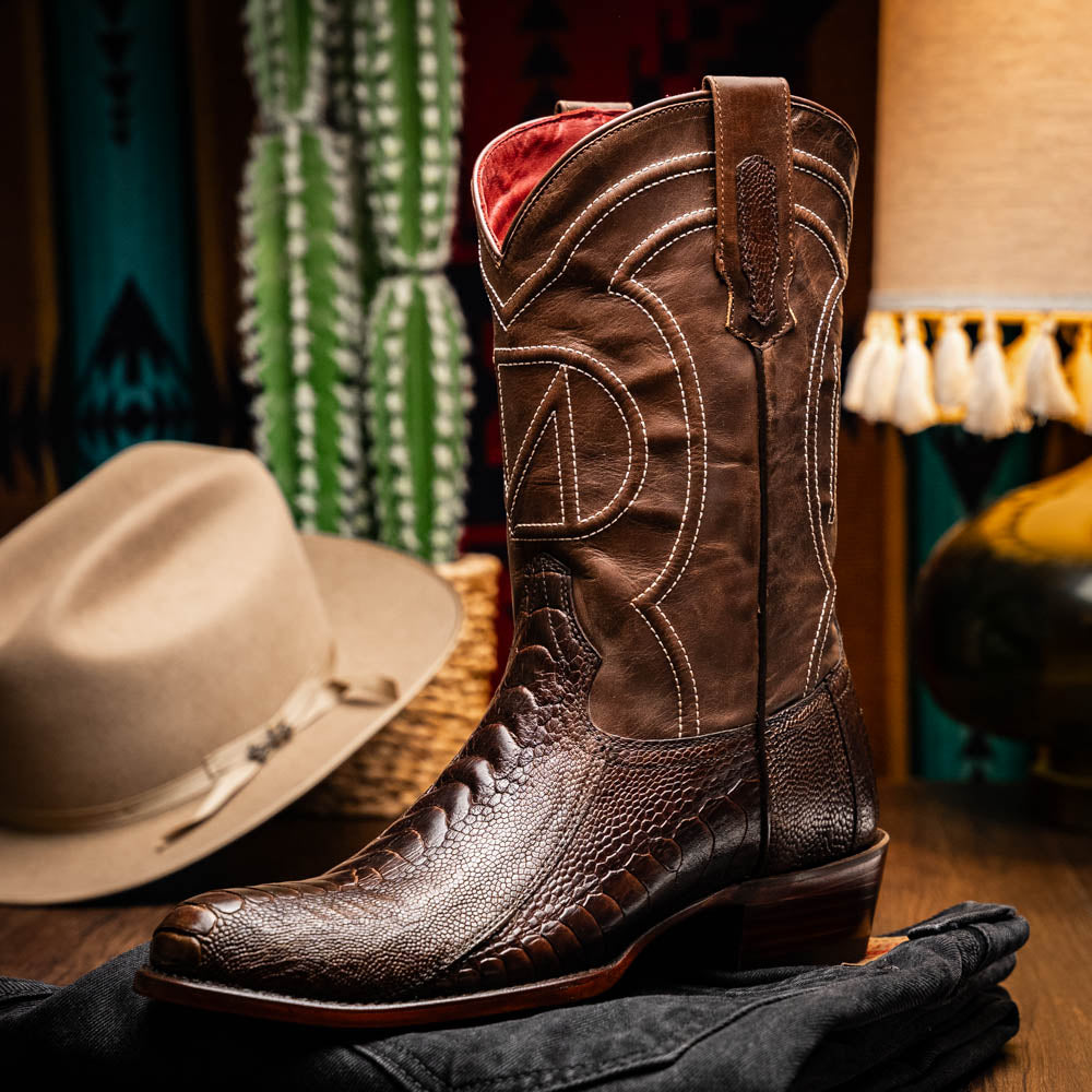 Denver Clear Brown cowboy boot made from genuine ostrich leg skin with deep red and black full-grain leather showcasing exotic elegance.