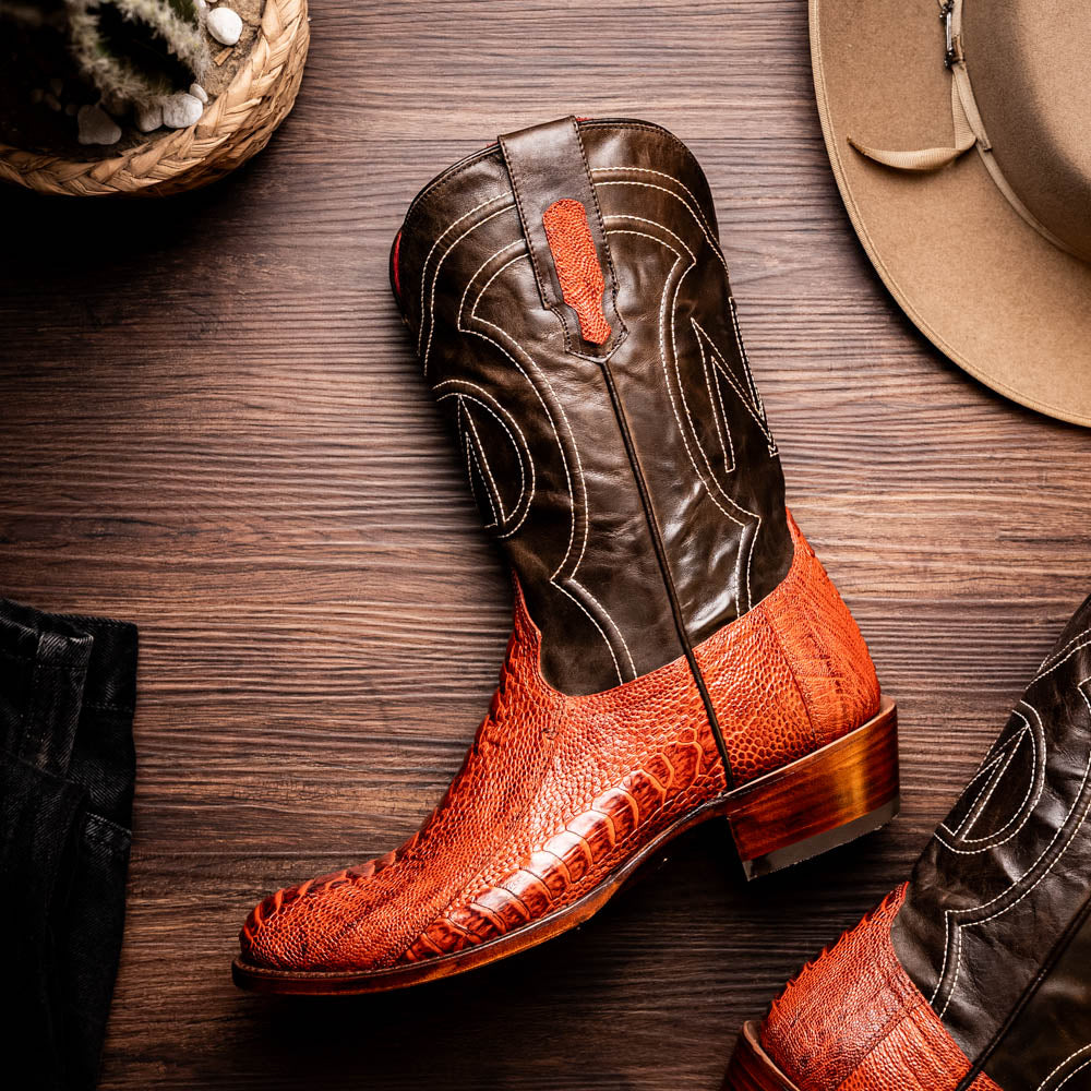 Denver Rustic Cognac boot crafted from genuine ostrich leg skin with deep red vamp and black full-grain leather detailing.