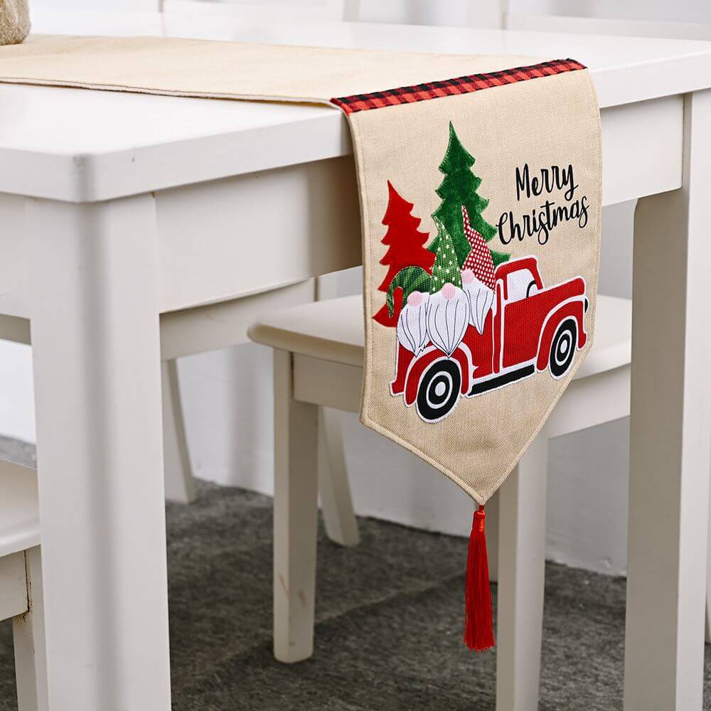 Christmas Santa Claus Car Table Runner on white table with festive design, adding charm to holiday decor