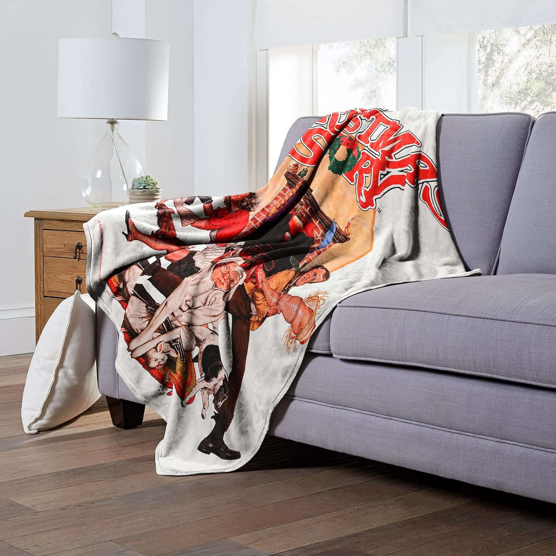 Luxurious Christmas Story Poster Throw Blanket on sofa, 50x60 inches, featuring A Christmas Story design, for cozy holiday nights.