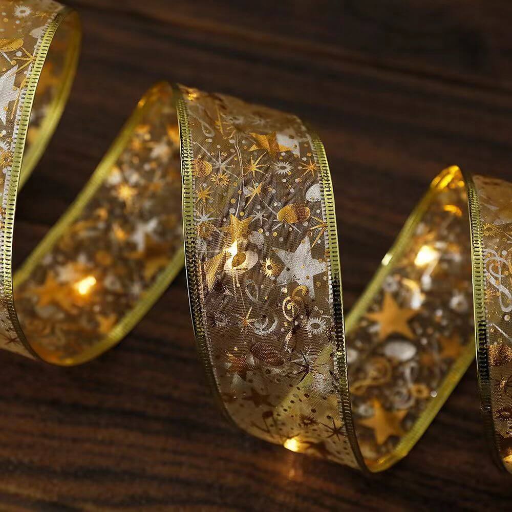 Christmas Glowing Ribbon Led Light String Bluetooth - Decorative gold ribbon with stars and lights for festive decoration.