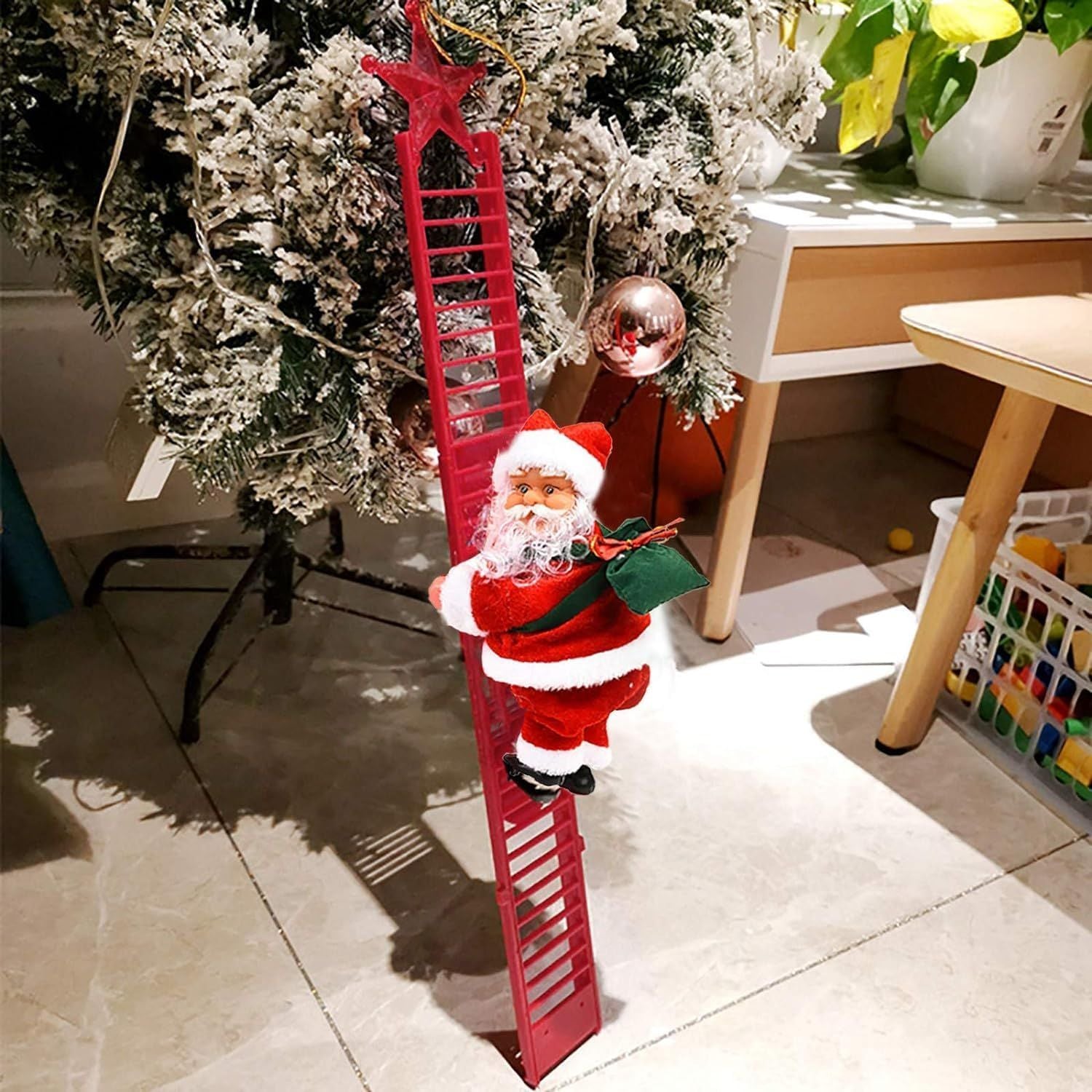 Christmas Electric Climbing Santa decoration with LED lights on a ladder by Christmas tree