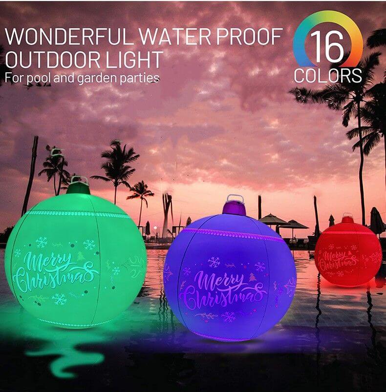 Inflatable Christmas Ball with 16 RGB colors illuminating a pool area, perfect for outdoor garden decoration and holiday celebrations.