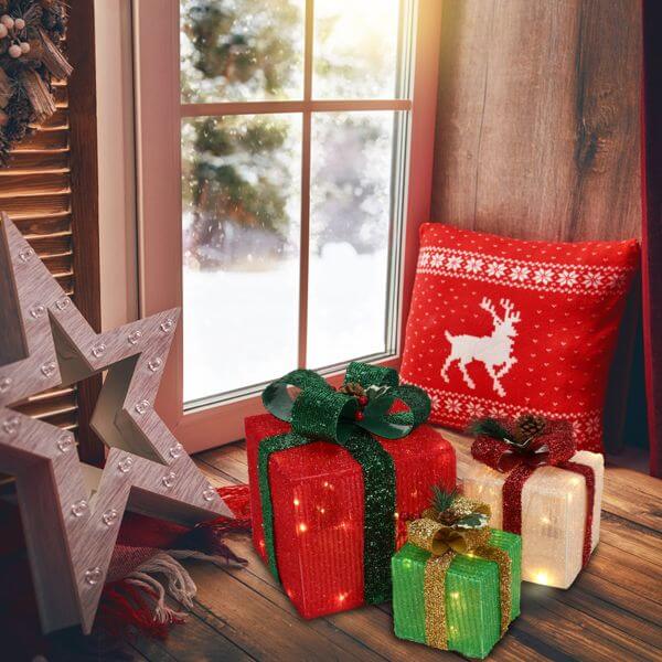 LED60 Light Warm White Christmas Gift Box 3-Piece Set with festive decor next to a window scene