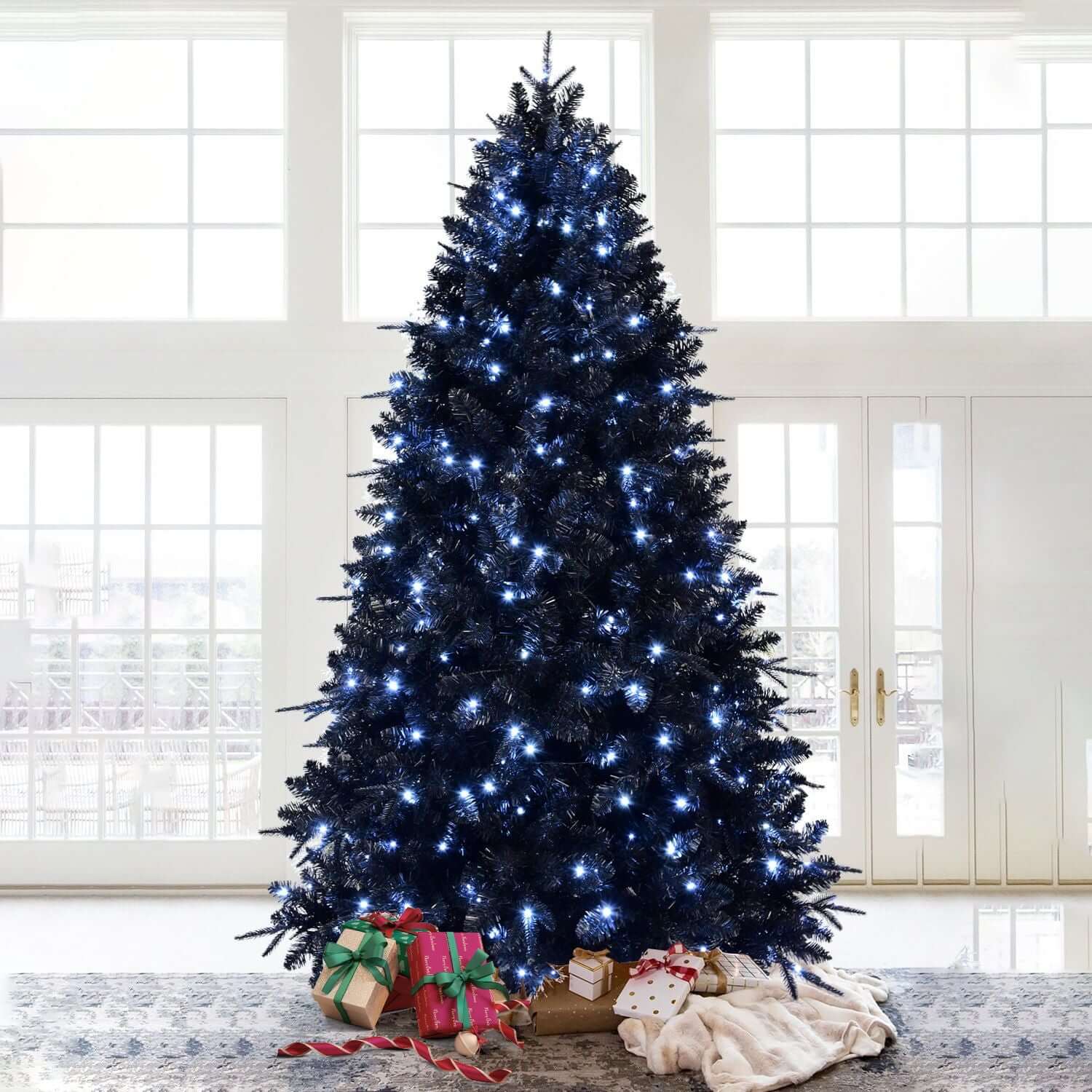 Black Christmas Tree with White LED Lights, 5ft tall, in modern holiday decor setting with gifts underneath.