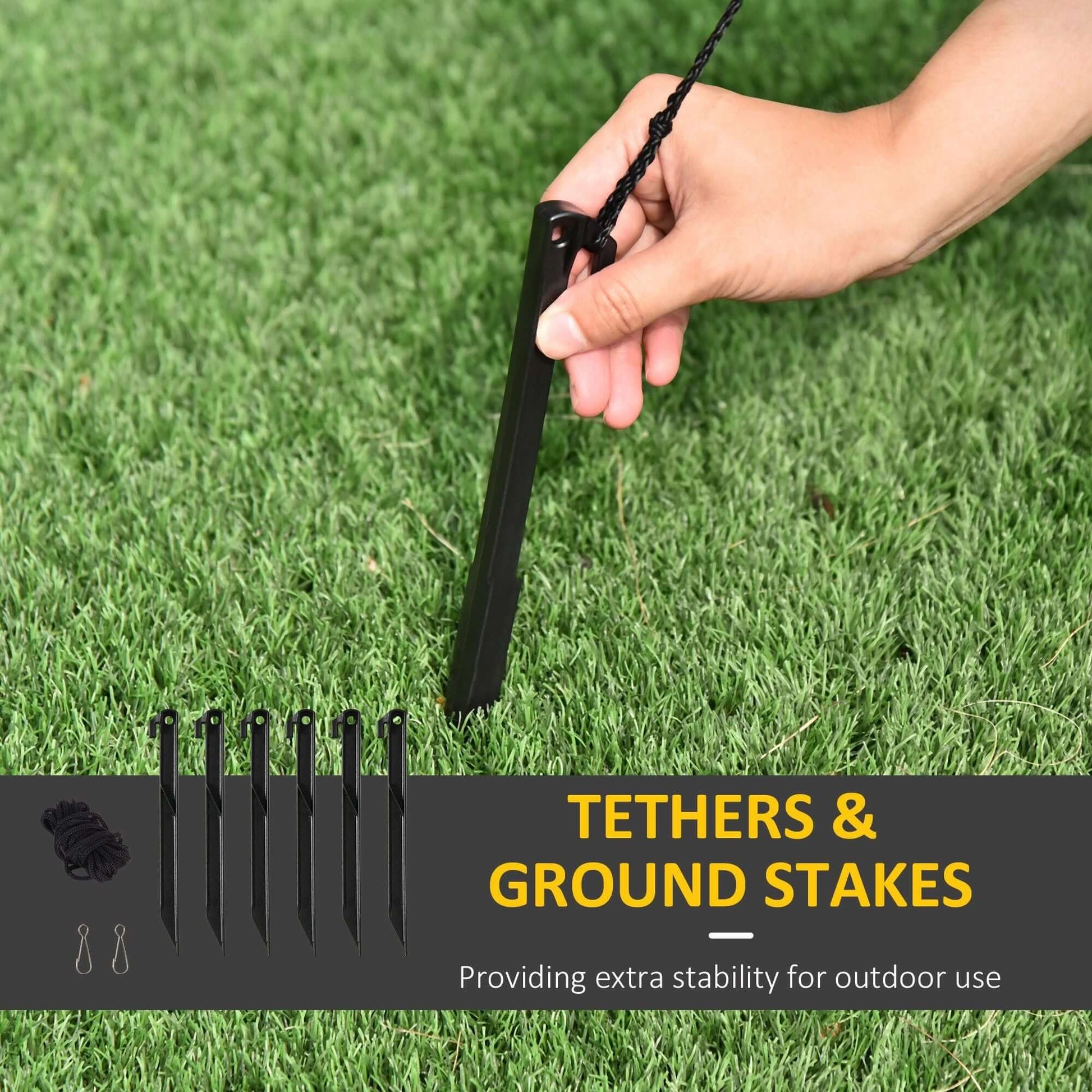 Tethers and ground stakes for securing the Christmas Inflatable Santa Claus with Sleigh outdoors on grass.