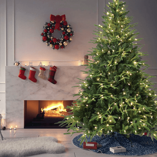Artificial Green Christmas Tree - 4ft Pre-Lit with 150 LED Lights in cozy living room setting