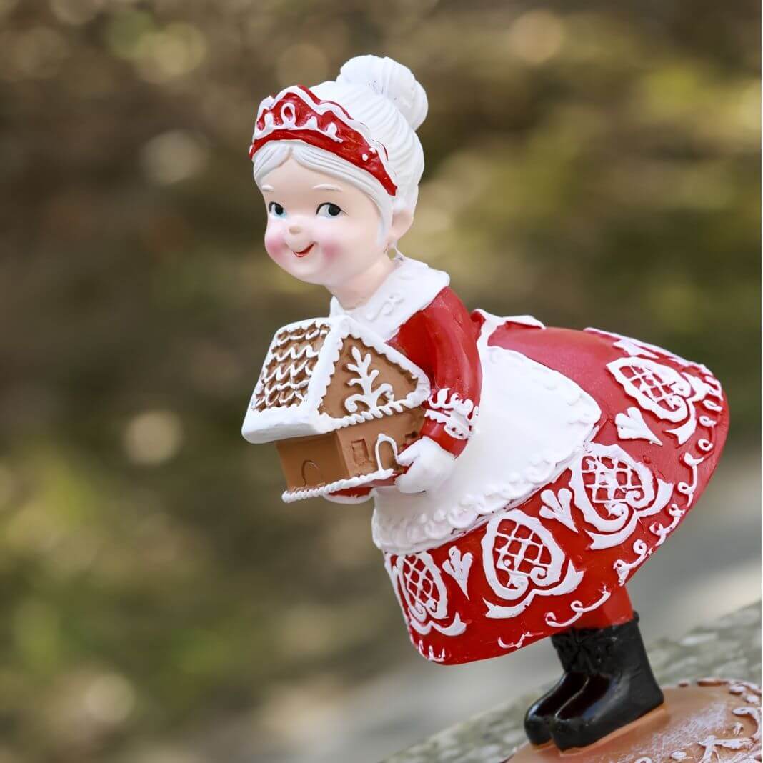 Small Ornament Couples Gifts Christmas Crafts resin figure in festive attire holding a gingerbread house, perfect for home decor.