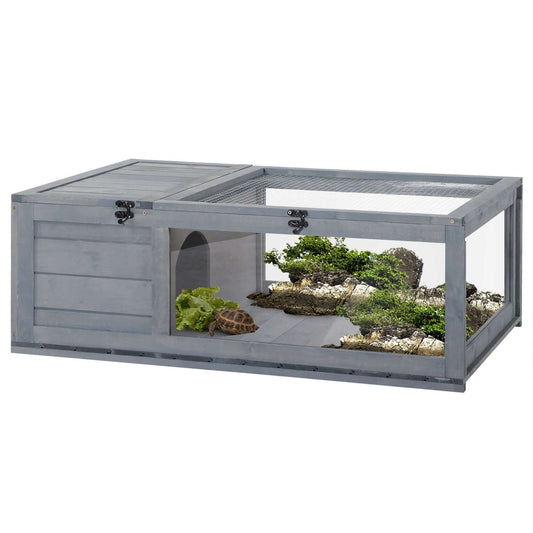 PawHut Wooden Tortoise House Indoor Turtle Habitat Enclosure Outdoor Reptile Cage Gray with plants and tortoise inside.