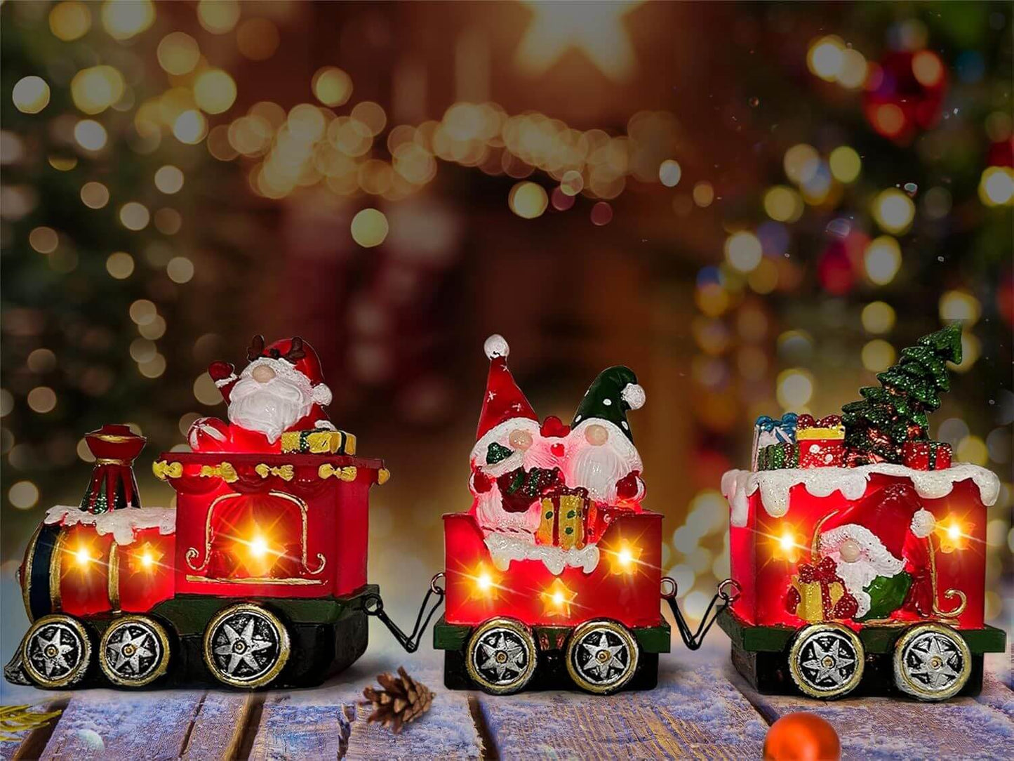 Christmas Gnome Decorations Centerpieces light up train set with glowing gnome figurines on a festive holiday table setting.