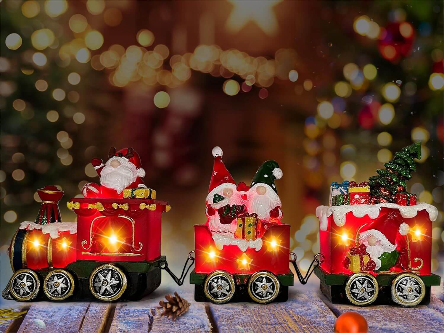 Christmas Gnome Decorations Centerpieces light up train set with glowing gnome figurines on a festive holiday table setting.