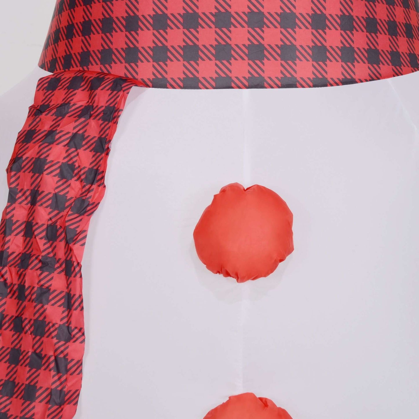 Close-up of Inflatable Snowman with checkered red scarf, showcasing festive design details.