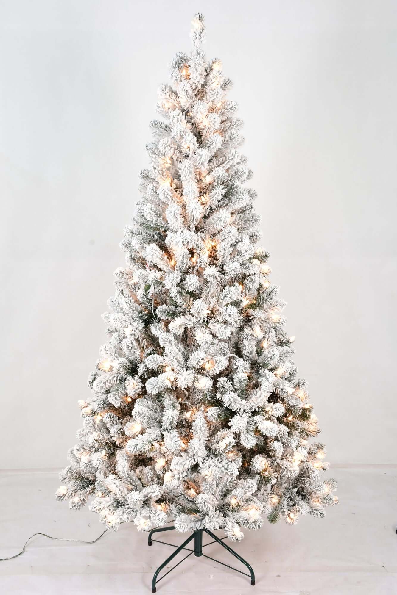 6FT Pre Lit Flocked Christmas Tree with 250 white lights and realistic snowy branches for festive indoor decor.