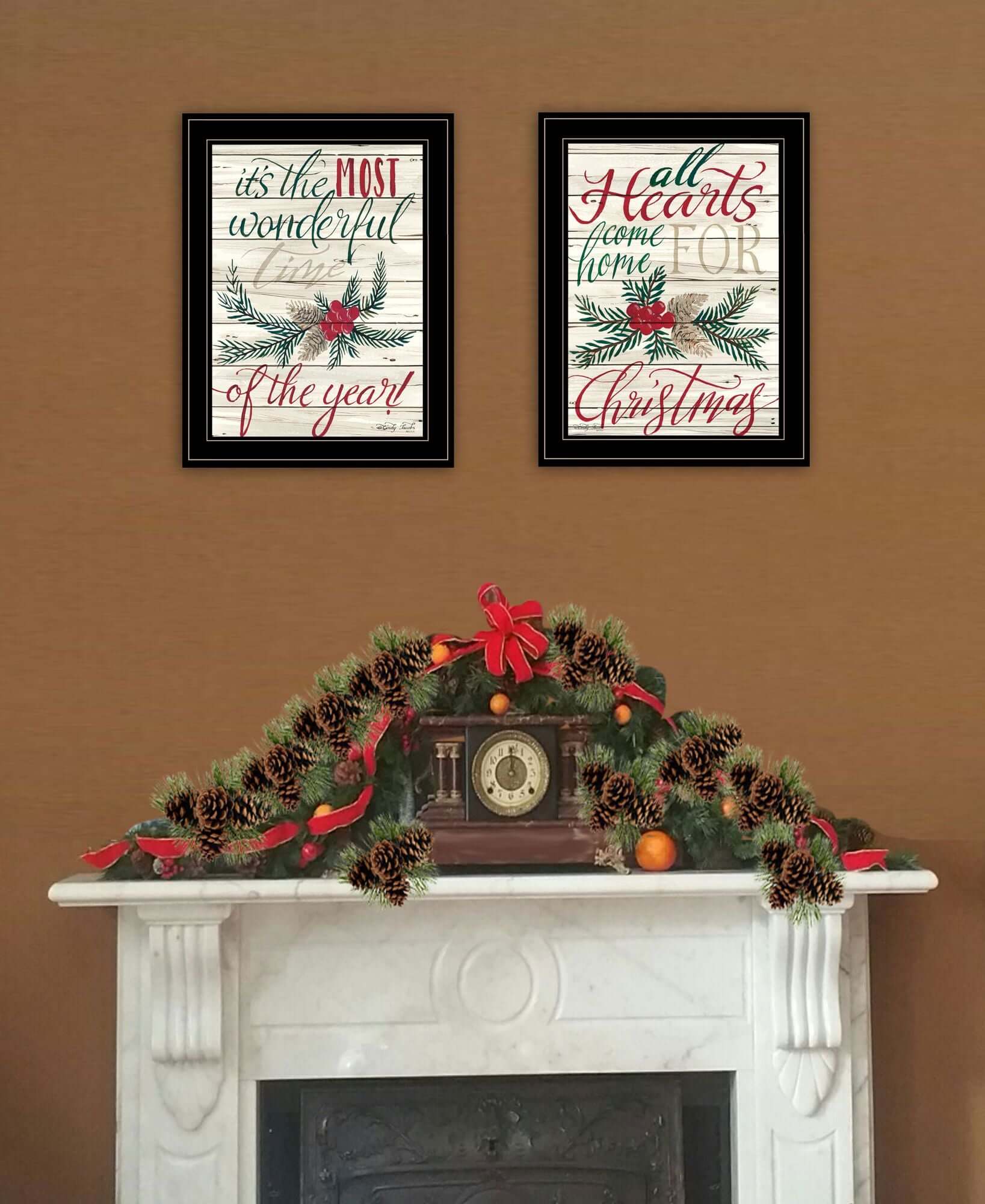 All Hearts Come Home for Christmas Vignette by Cindy Jacobs with two framed holiday prints above a festive mantel display.